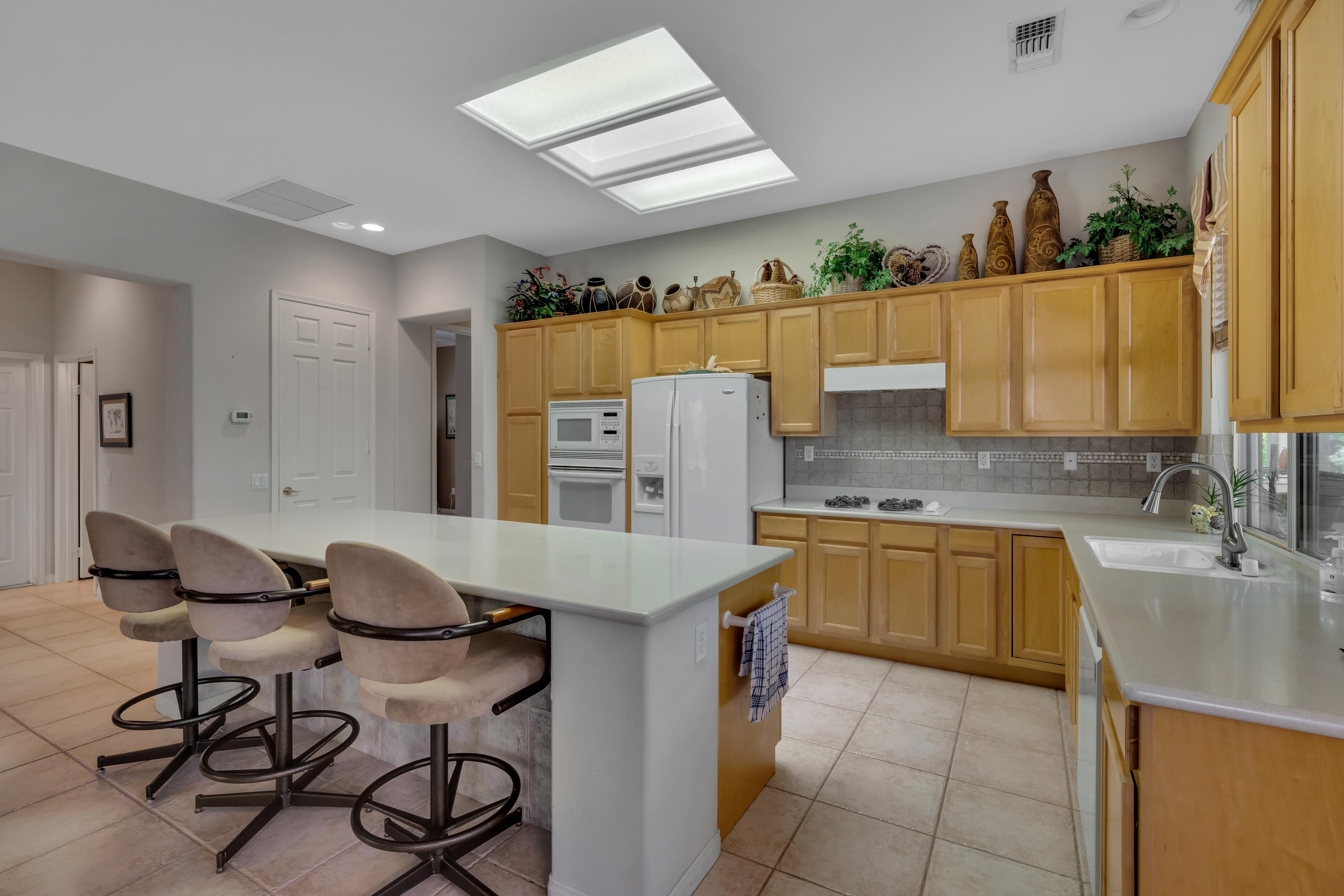 37384 Wyndham Road Palm Desert, CA 92211 - Photo 14 of 30 a kitchen with a sink cabinets and window