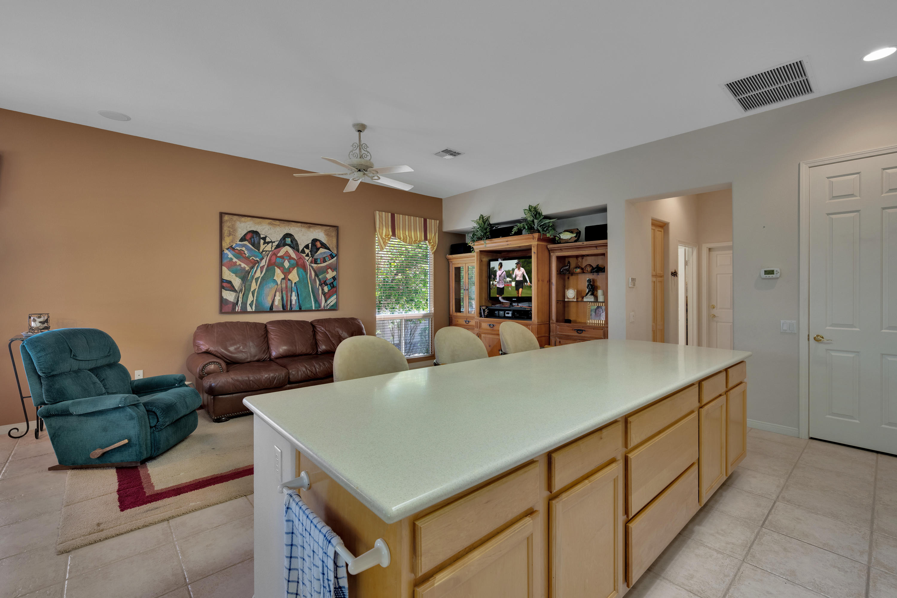 37384 Wyndham Road Palm Desert, CA 92211 - Photo 15 of 30 a living room with furniture and a large window
