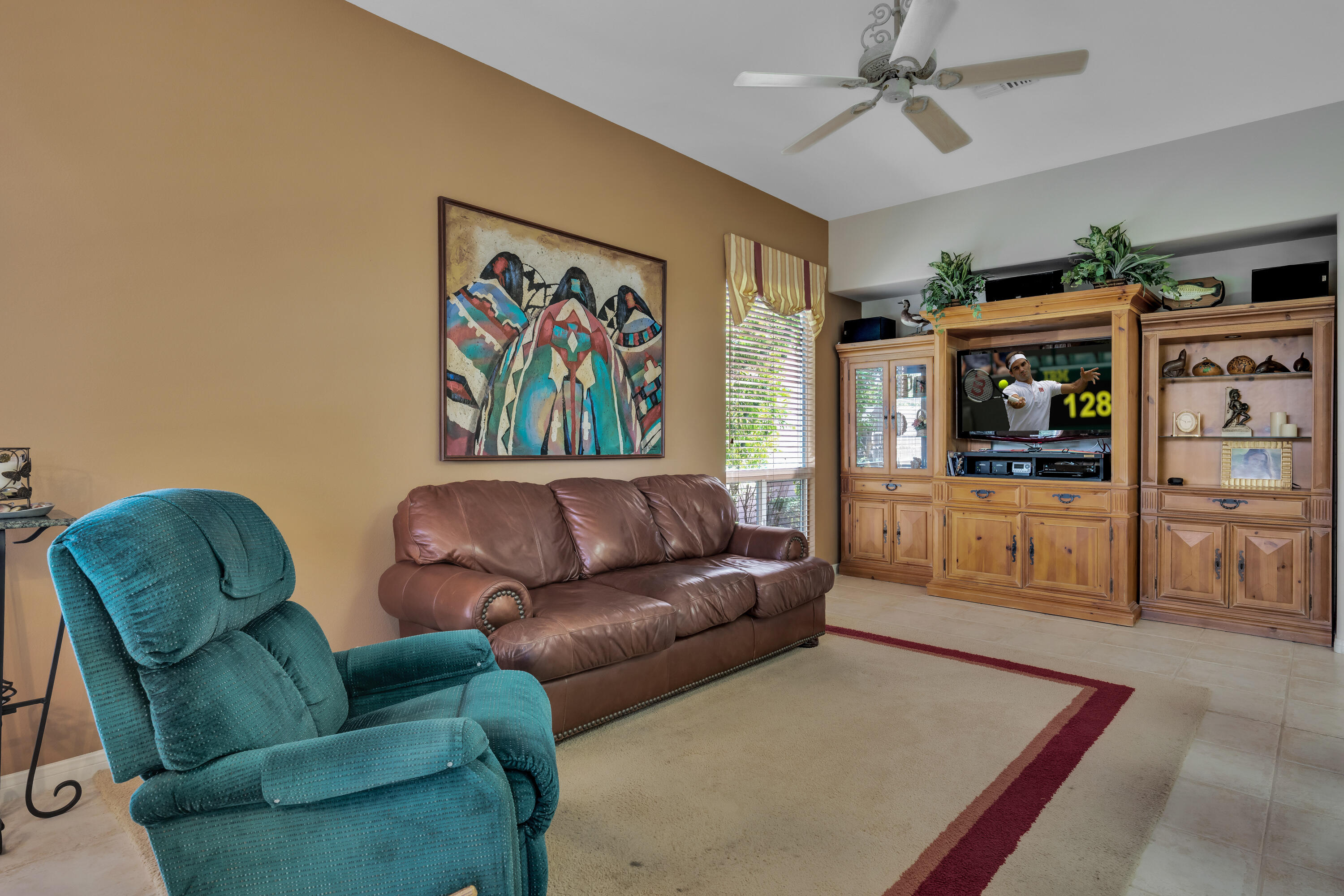 37384 Wyndham Road Palm Desert, CA 92211 - Photo 17 of 30 a living room with furniture and a flat screen tv