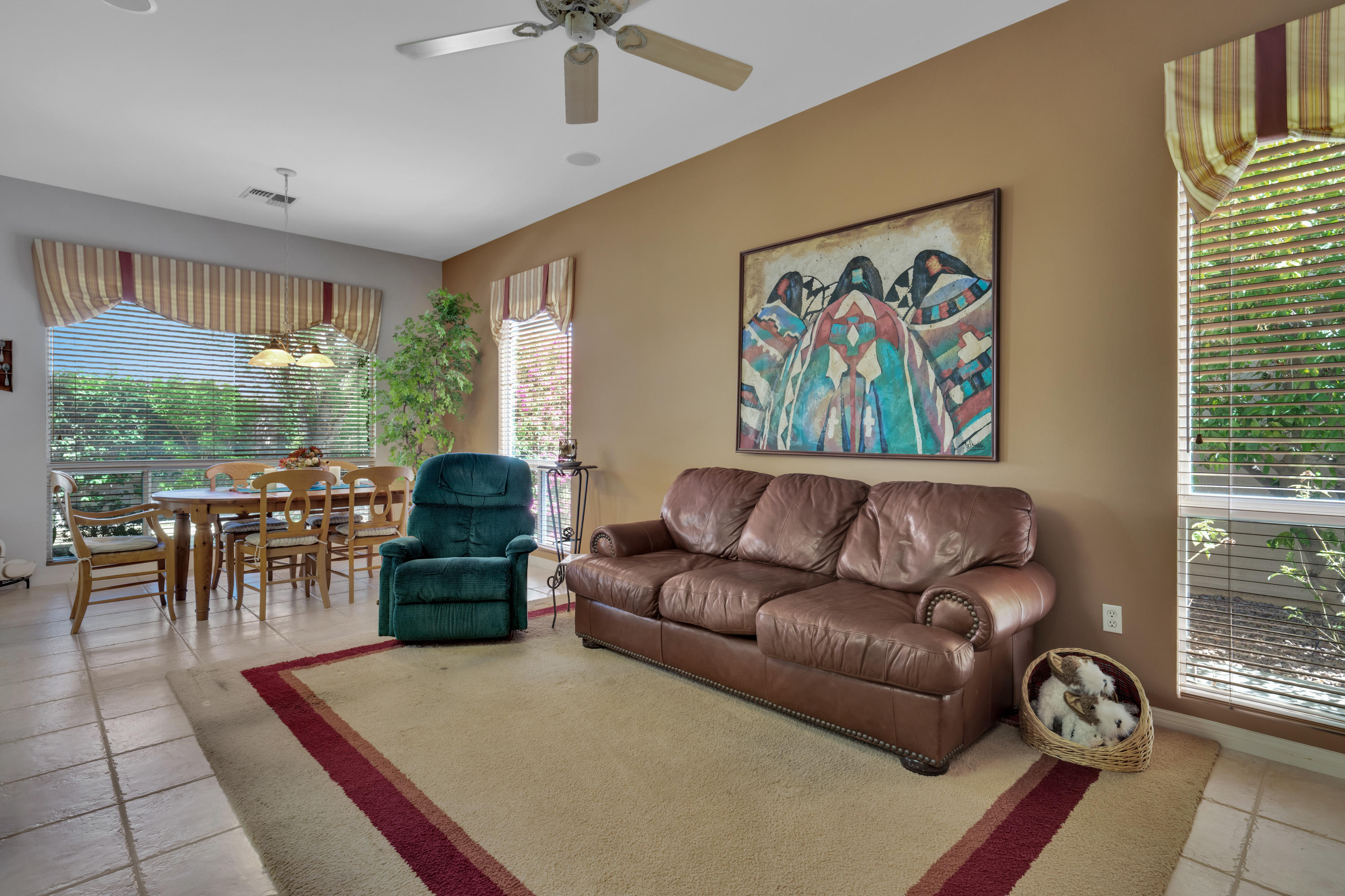 37384 Wyndham Road Palm Desert, CA 92211 - Photo 18 of 30 a living room with furniture and a large window
