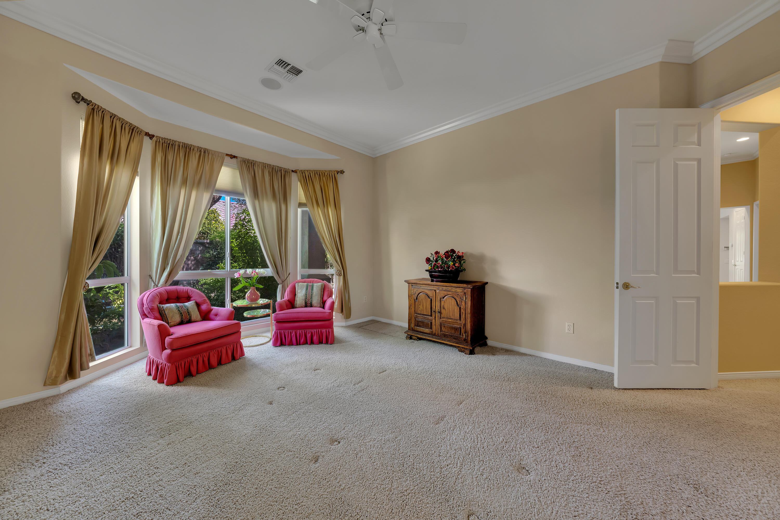 37384 Wyndham Road Palm Desert, CA 92211 - Photo 21 of 30 a living room with furniture and a large window