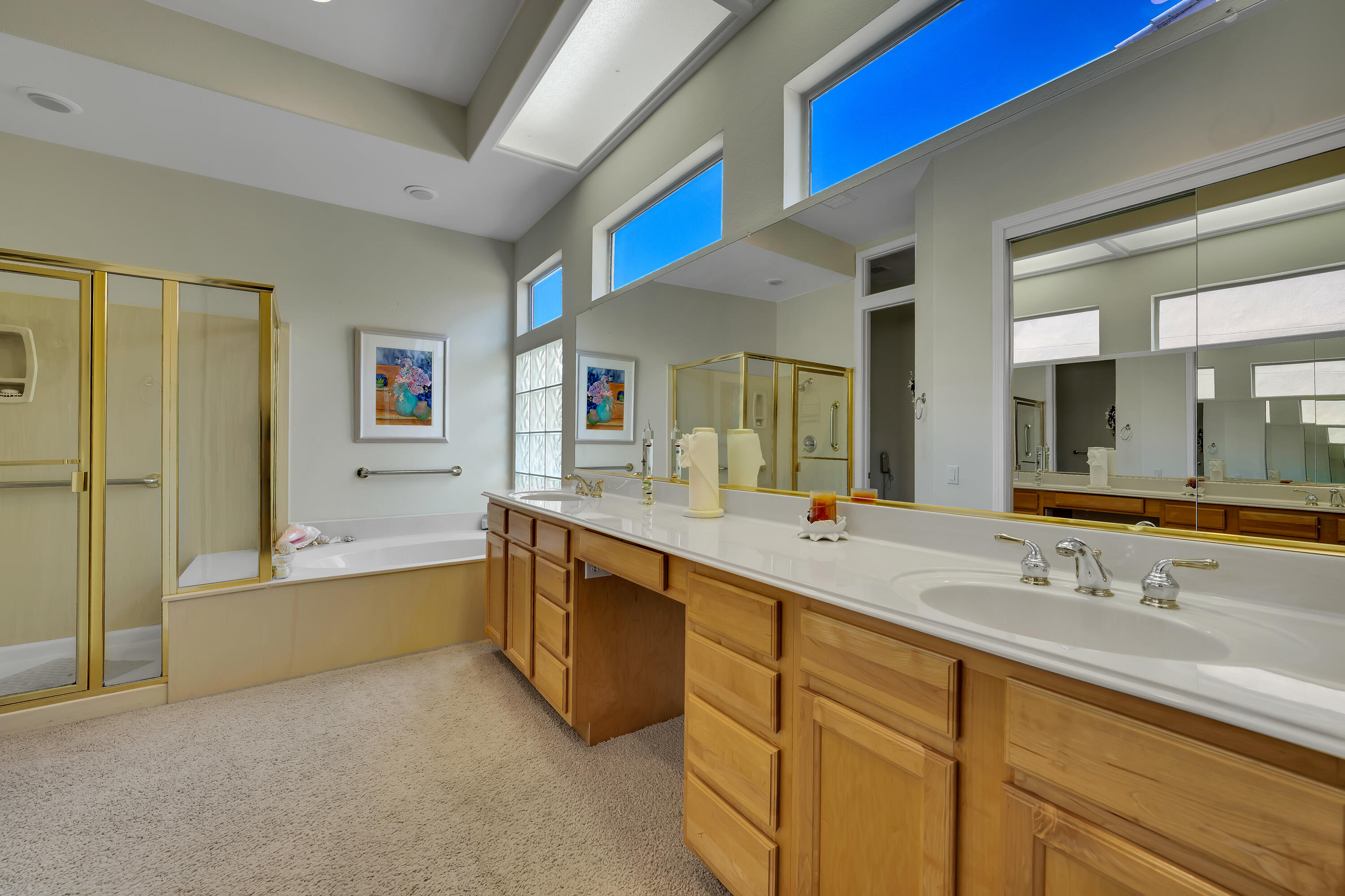 37384 Wyndham Road Palm Desert, CA 92211 - Photo 22 of 30 a spacious bathroom with a tub sink and mirror