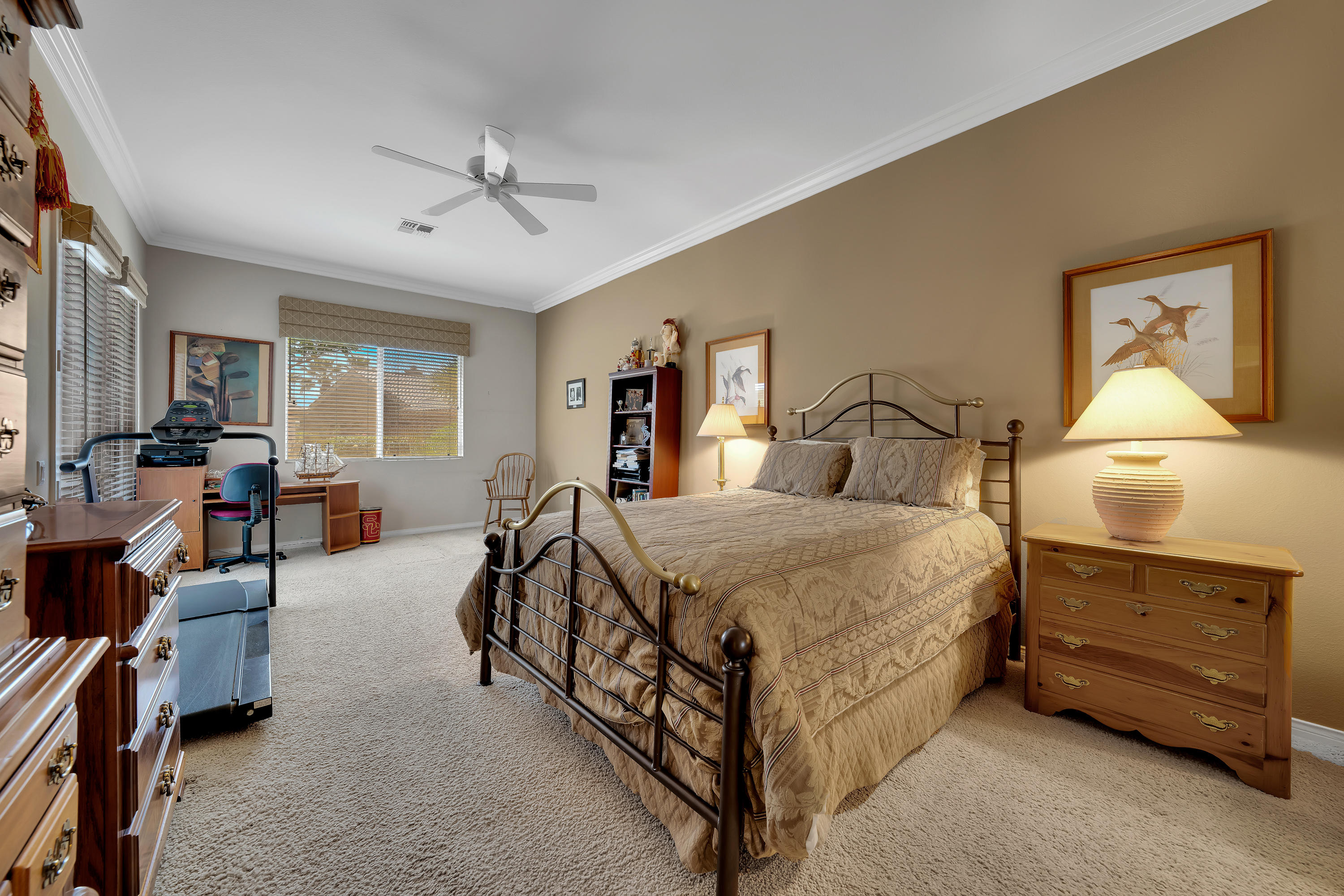 37384 Wyndham Road Palm Desert, CA 92211 - Photo 24 of 30 a bedroom with a bed and a dresser