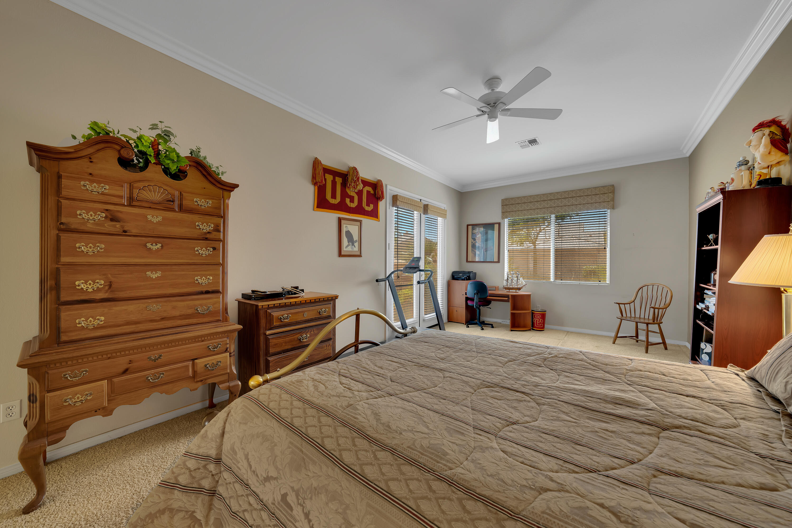 37384 Wyndham Road Palm Desert, CA 92211 - Photo 25 of 30 a bedroom with a bed and a chandelier