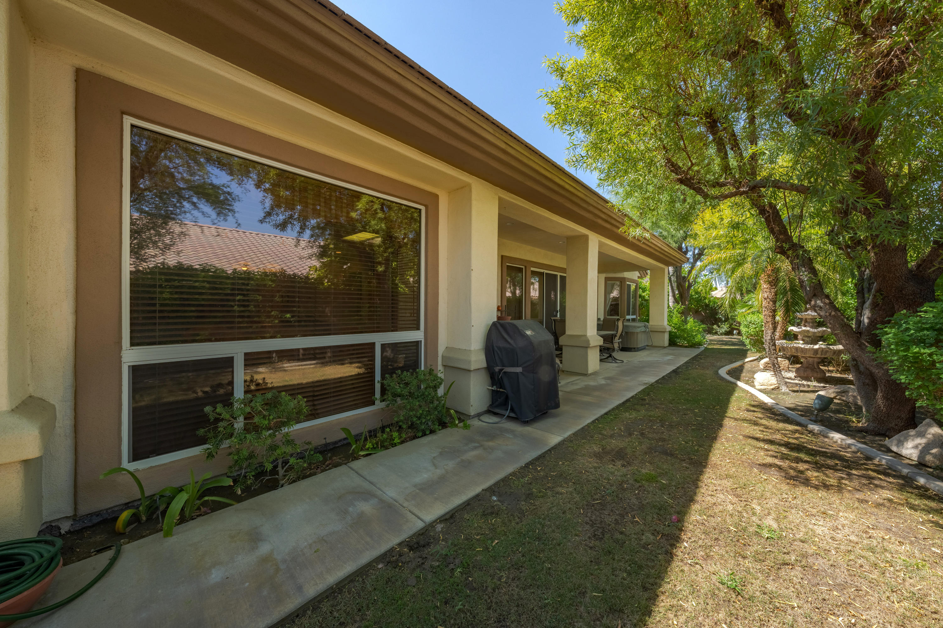 37384 Wyndham Road Palm Desert, CA 92211 - Photo 6 of 30 a view of a porch with wooden floor and fence