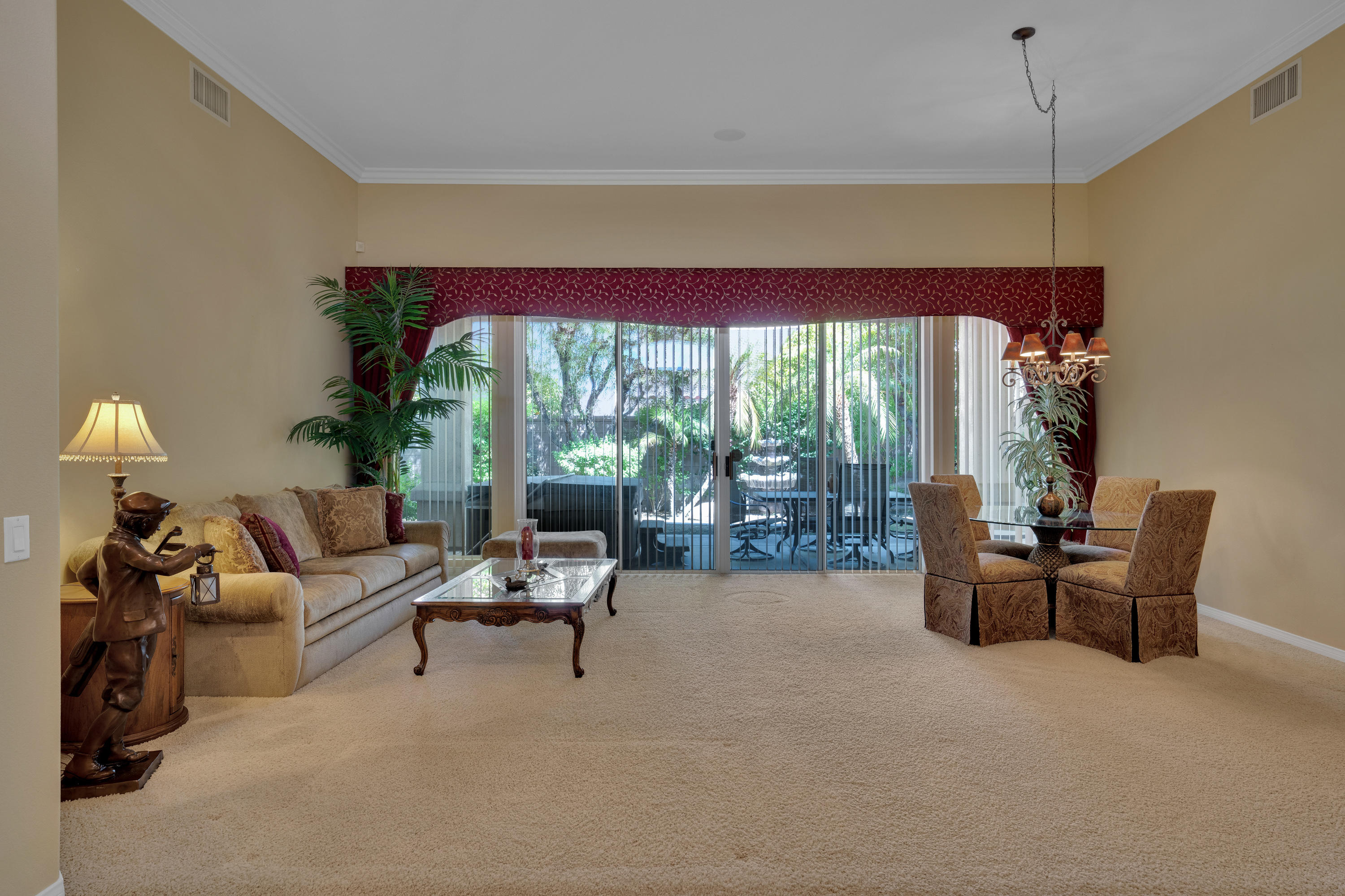 37384 Wyndham Road Palm Desert, CA 92211 - Photo 9 of 30 a living room with furniture and a large window