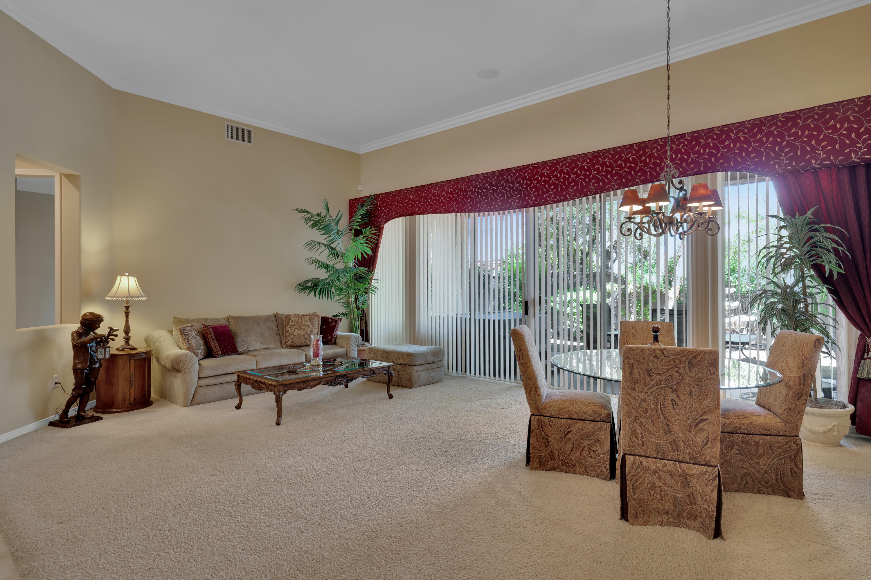 37384 Wyndham Road Palm Desert, CA 92211 - Photo 10 of 30 a living room with furniture and a large window