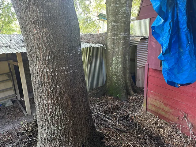 a view of a house with a tree