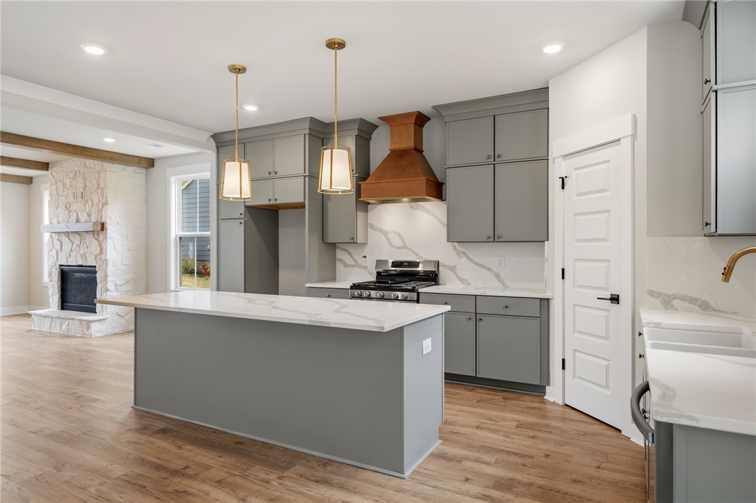 319 Summerall Drive Anderson, SC 29621 - Photo 10 of 37 This spacious kitchen offers an island, modern appliances, and seamless flow into the living area.