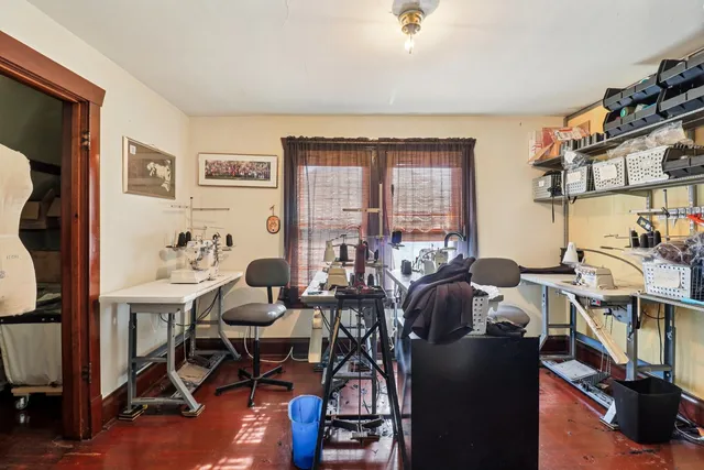 a view of a livingroom with furniture and a window