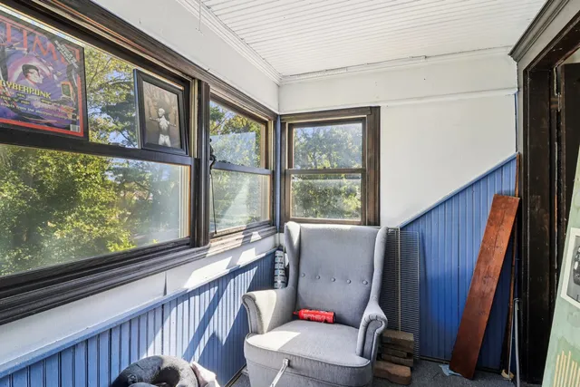 a view of chair and couch in the balcony