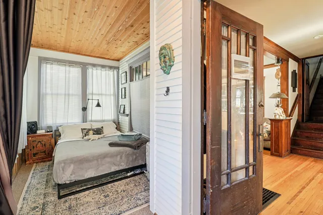 a bedroom with furniture and a window