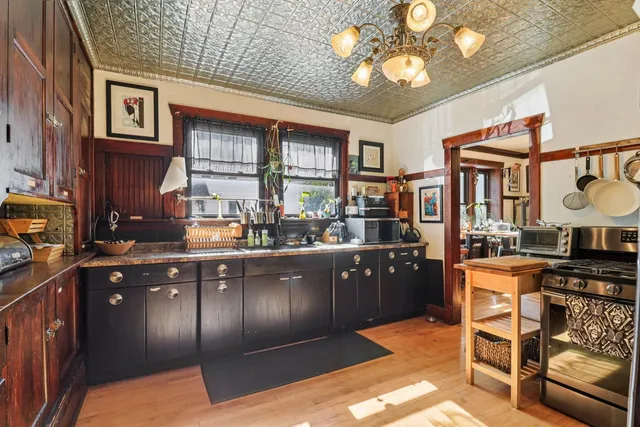 a kitchen with stainless steel appliances granite countertop a sink and cabinets
