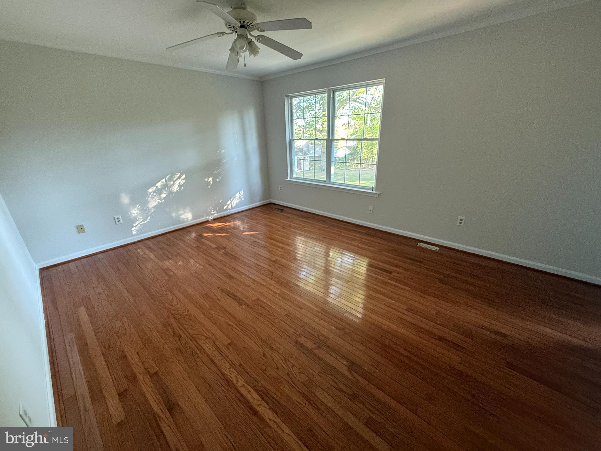 6375 Waterloo Road Elkridge, MD 21075 - Photo 8 of 18 wooden floor in an empty room with a window