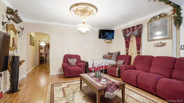 a view of a dining room with furniture and chandelier