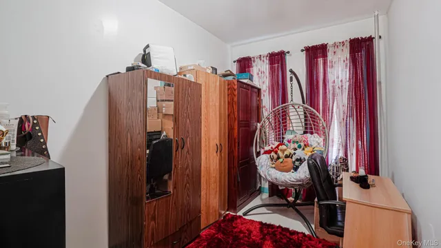 a bedroom with a bed and a mirror