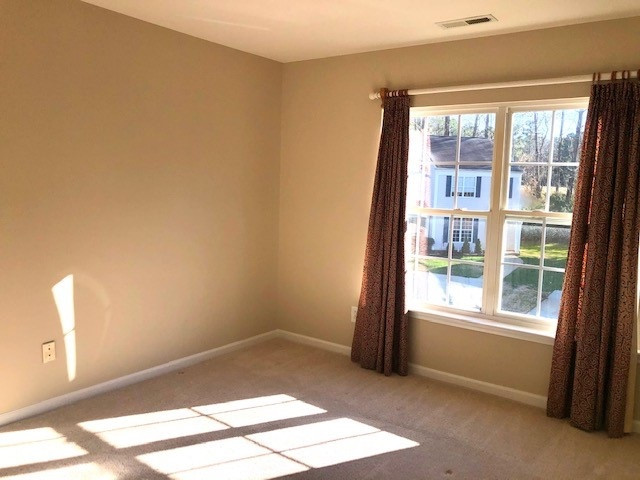 4235 Vienna Crest Drive Raleigh, NC 27613 - Photo 11 of 11 a view of an empty room and window