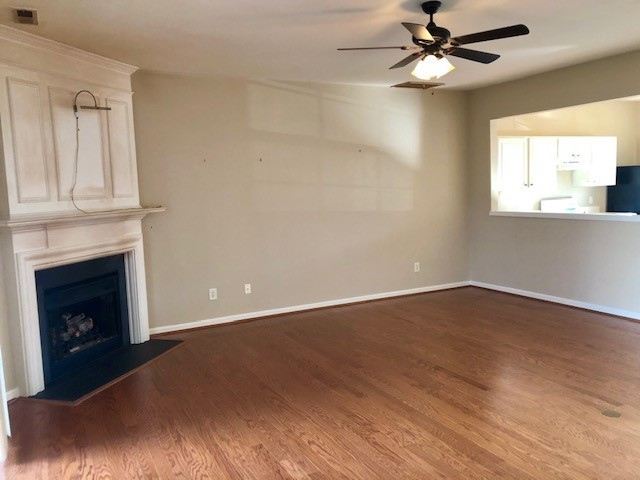 4235 Vienna Crest Drive Raleigh, NC 27613 - Photo 2 of 11 a view of an empty room with wooden floor and a window