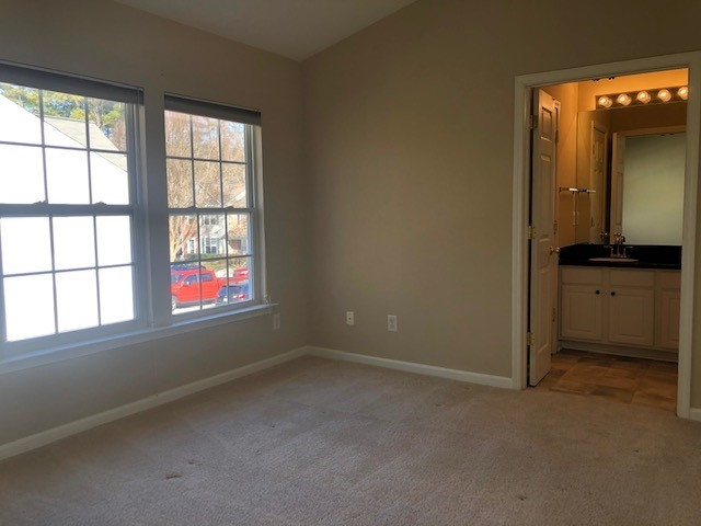 4235 Vienna Crest Drive Raleigh, NC 27613 - Photo 7 of 11 an empty room with a window