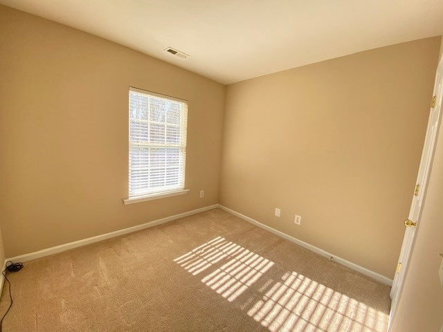 4235 Vienna Crest Drive Raleigh, NC 27613 - Photo 9 of 11 a view of an empty room with a window