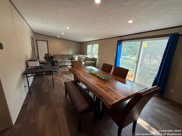 a view of a dining room with furniture window and outside view