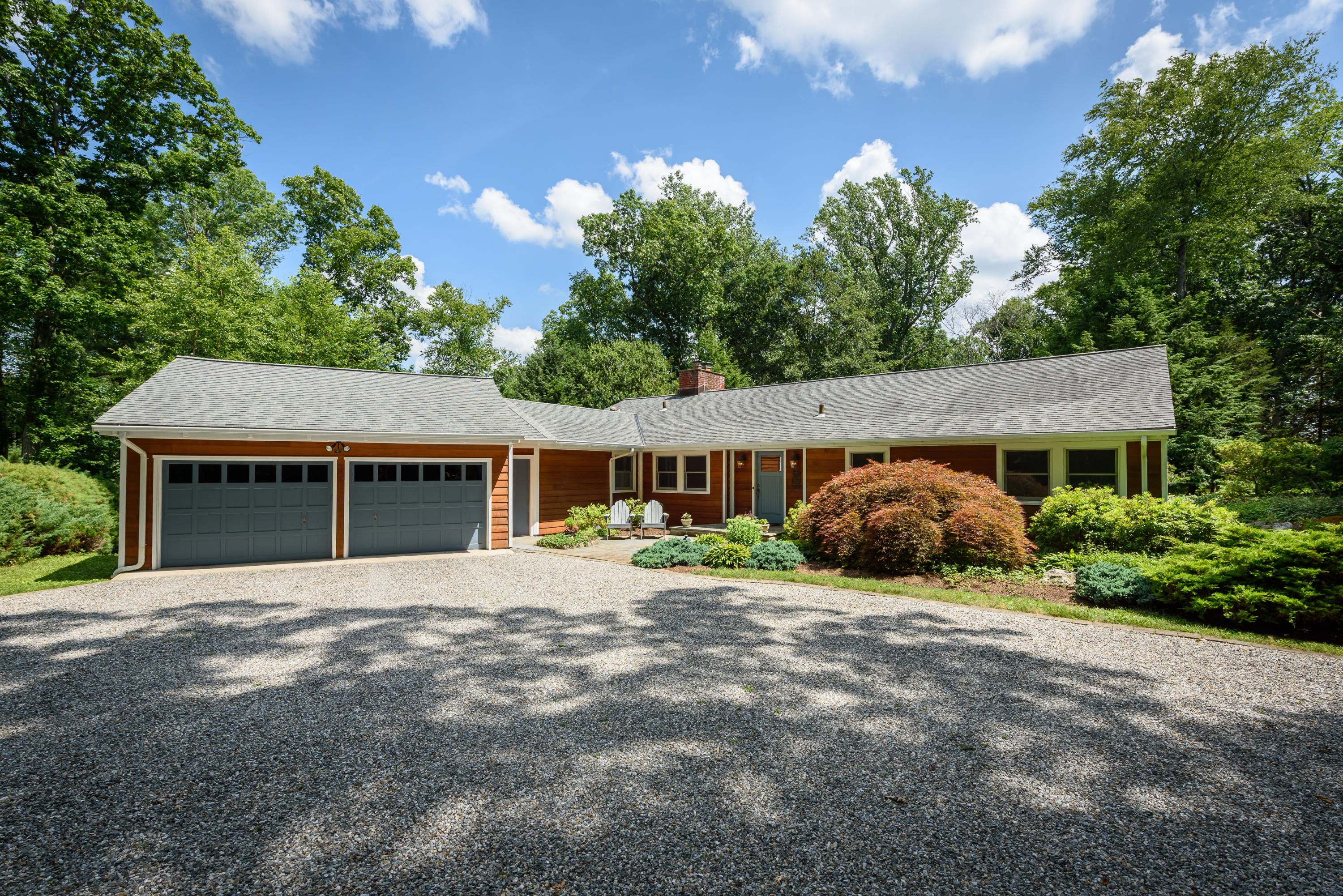 52 Boulderol Road Stamford, CT 06903 - Photo 1 of 18 a front view of a house with a garden