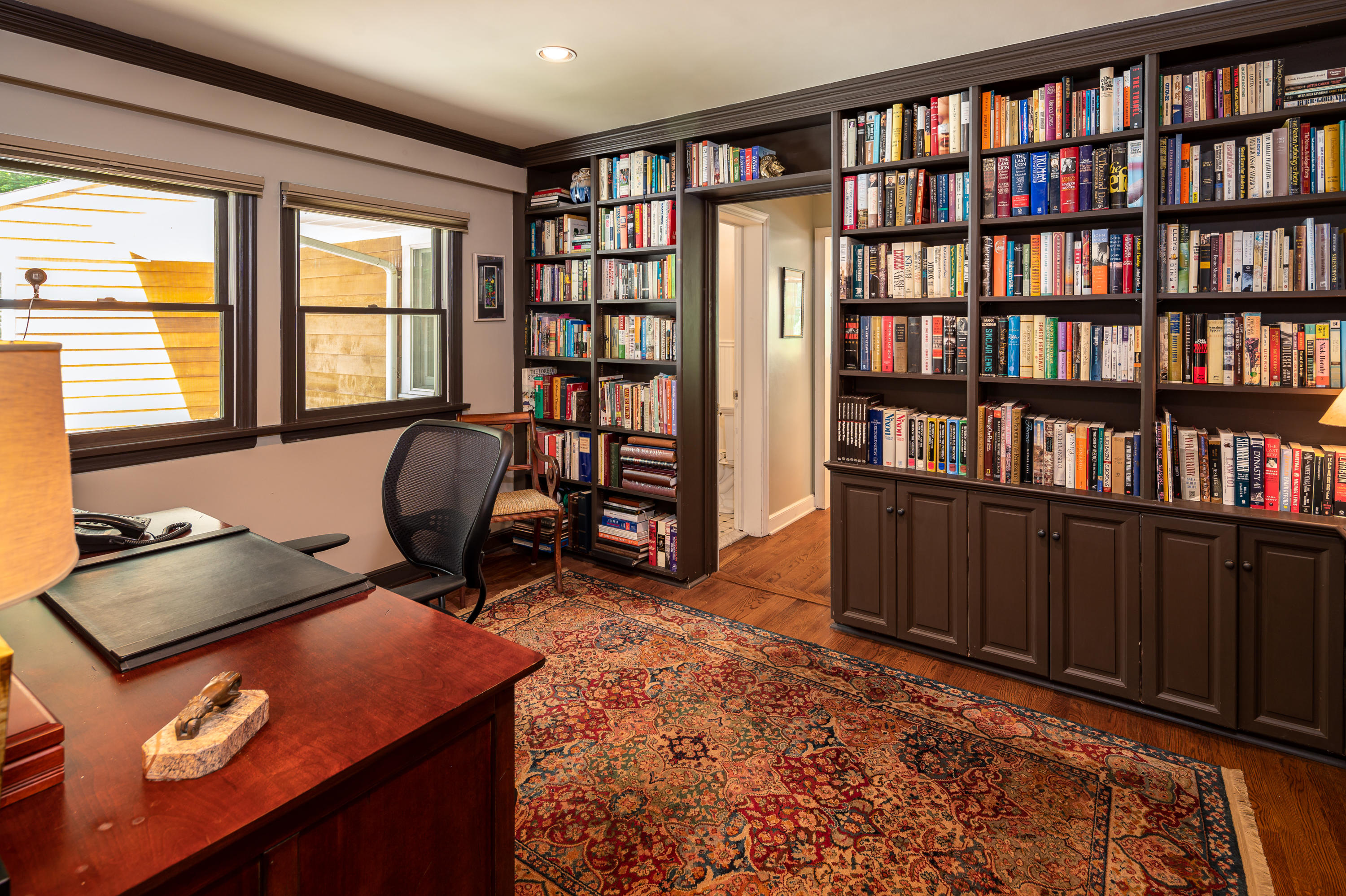 52 Boulderol Road Stamford, CT 06903 - Photo 11 of 18 a view of a workspace with furniture and a bookshelf