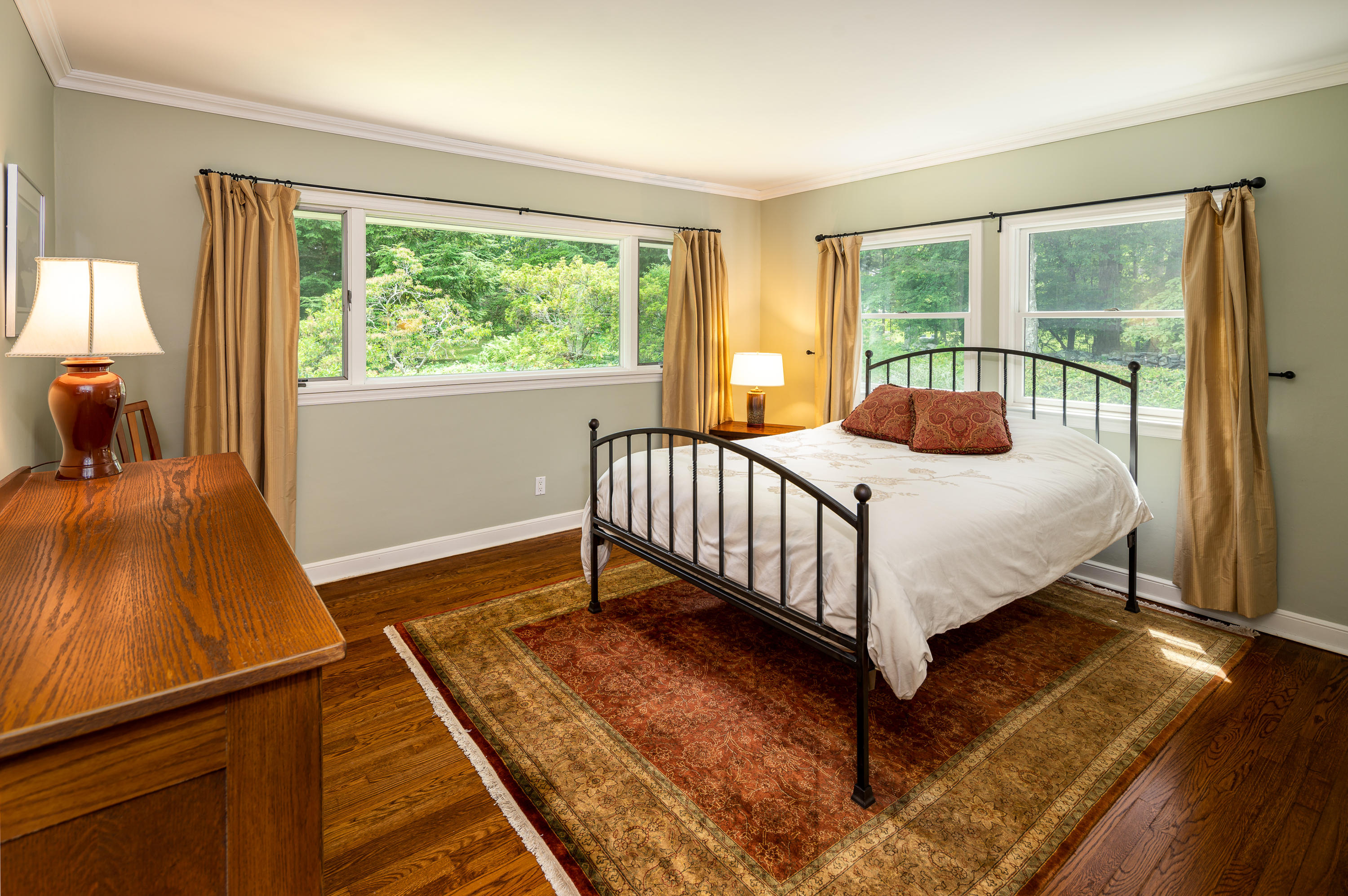 52 Boulderol Road Stamford, CT 06903 - Photo 12 of 18 a bed sitting in a bedroom next to a window