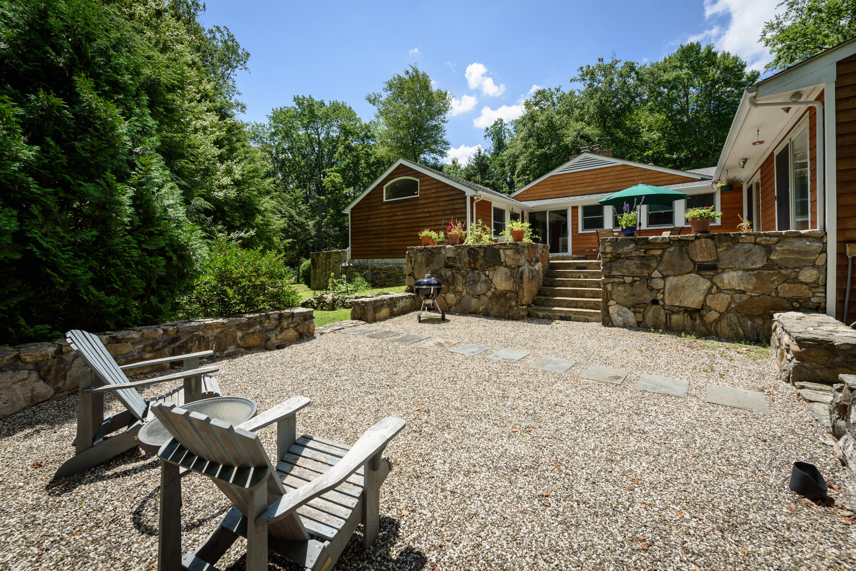 52 Boulderol Road Stamford, CT 06903 - Photo 15 of 18 a front view of a house with yard porch and furniture