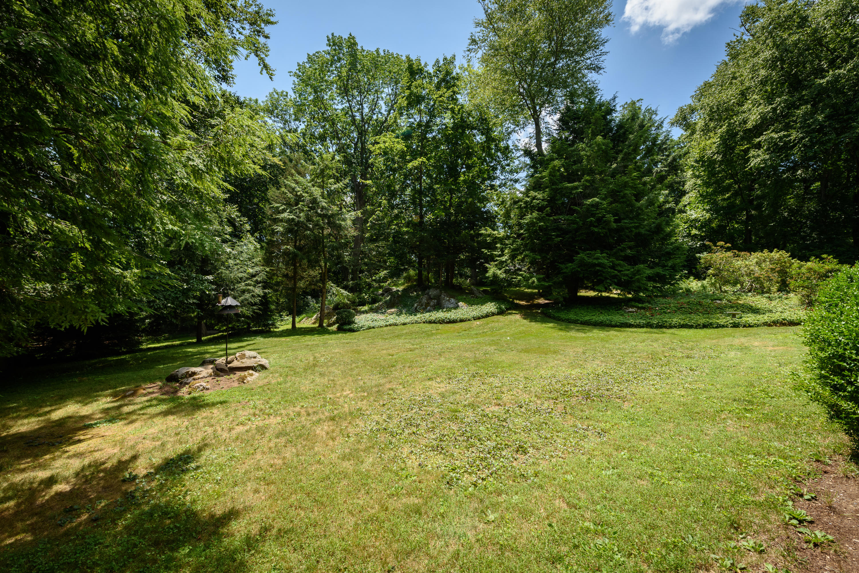 52 Boulderol Road Stamford, CT 06903 - Photo 17 of 18 a view of a swimming pool with an outdoor space and seating area