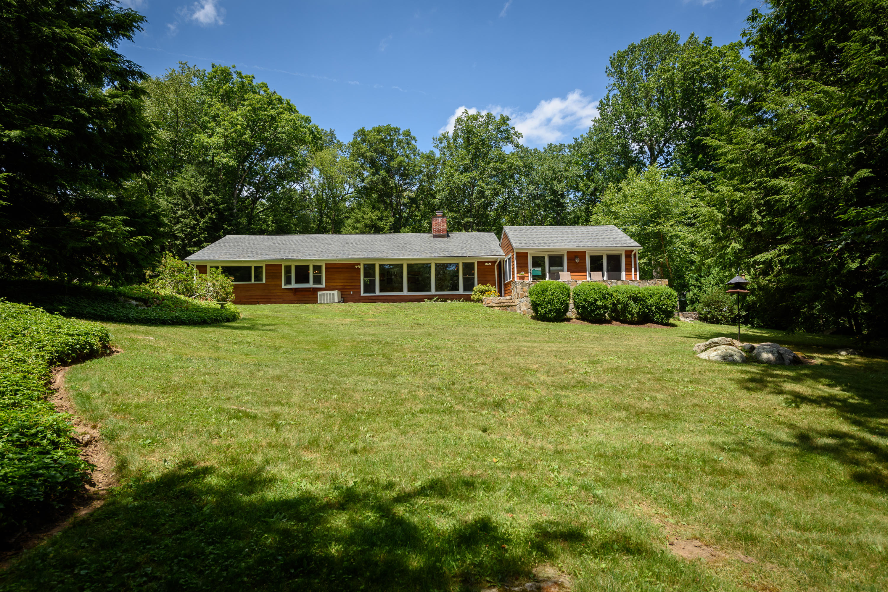 52 Boulderol Road Stamford, CT 06903 - Photo 18 of 18 a view of a house with a big yard