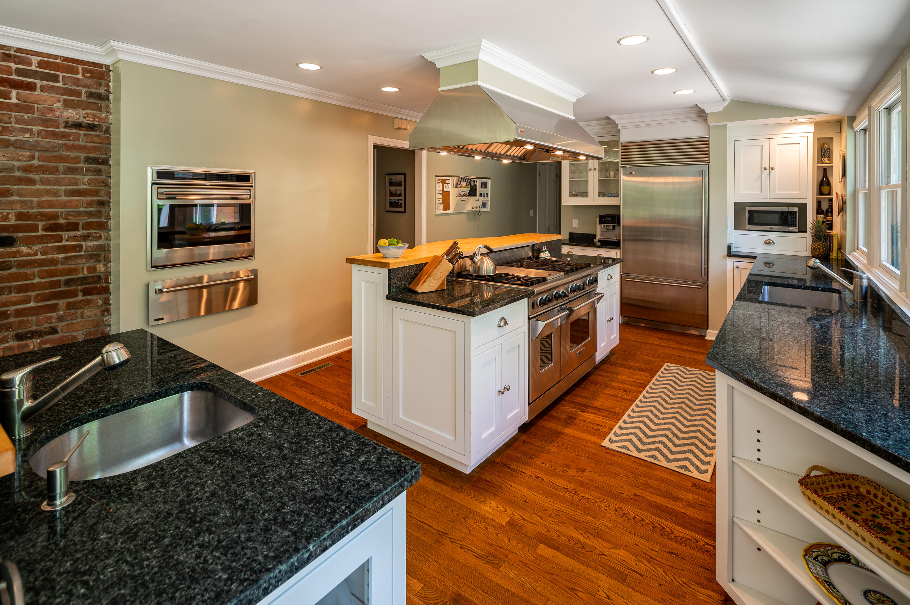 52 Boulderol Road Stamford, CT 06903 - Photo 3 of 18 a kitchen with stainless steel appliances granite countertop a stove and a sink
