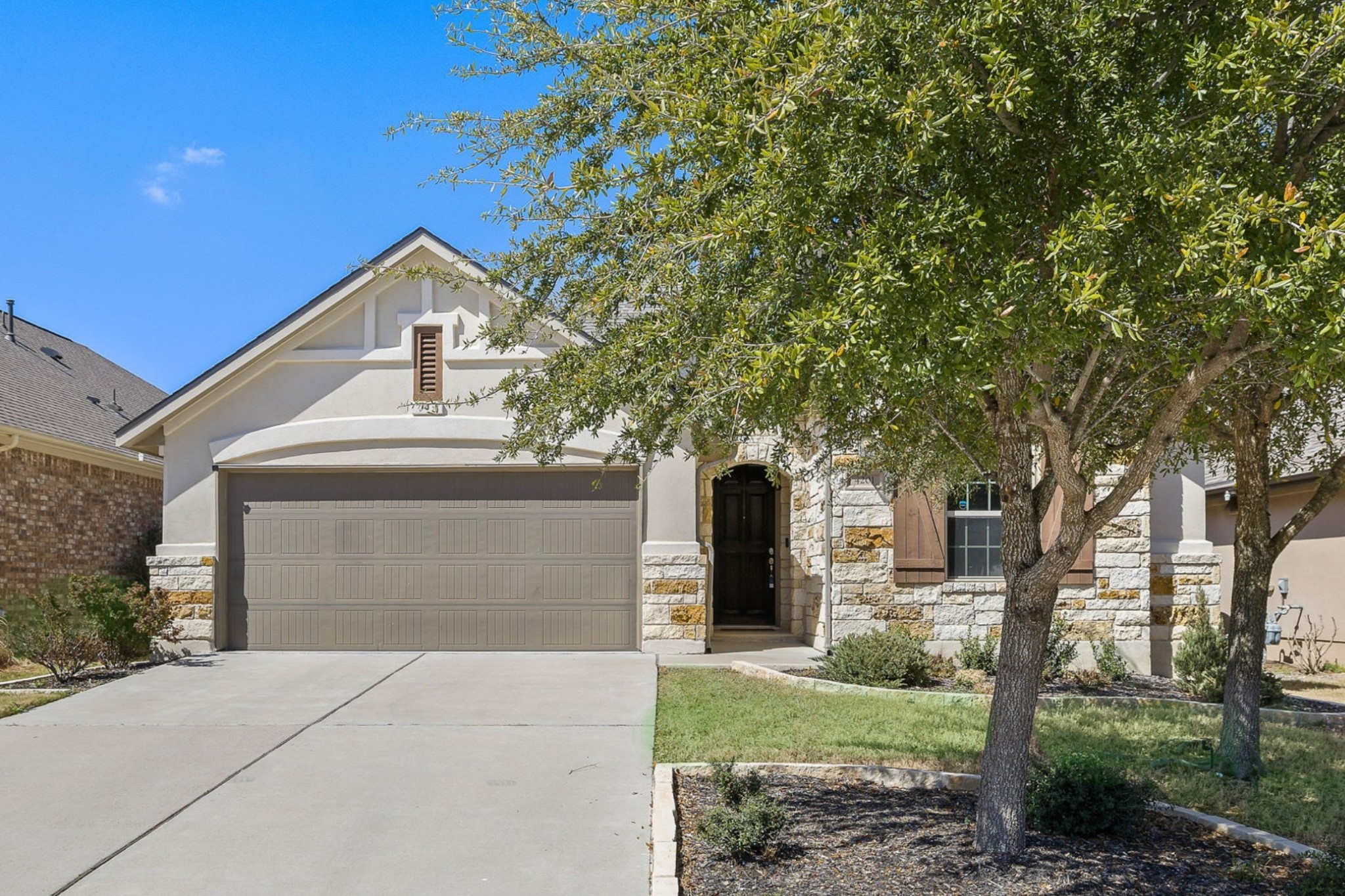 4201 Vespa Cove Leander, TX 78641 - Photo 2 of 29 a front view of a house with garden