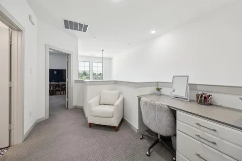 a kitchen with sink cabinets and stove top oven