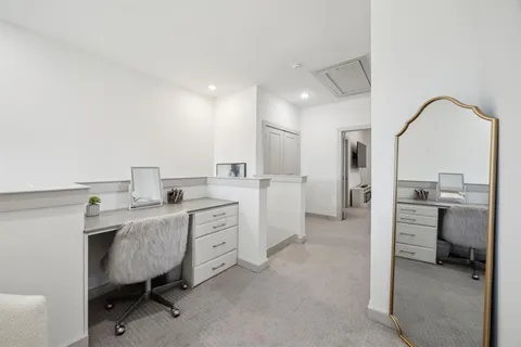 a view of a workspace with furniture