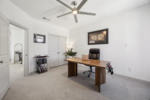 a view of a livingroom with furniture and a flat screen tv