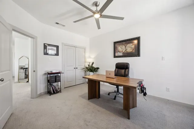 a view of a livingroom with furniture and a flat screen tv