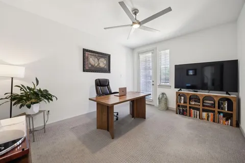 a bathroom with a sink toilet a mirror and shower