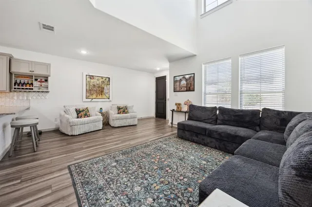 a living room with a couch and a rug