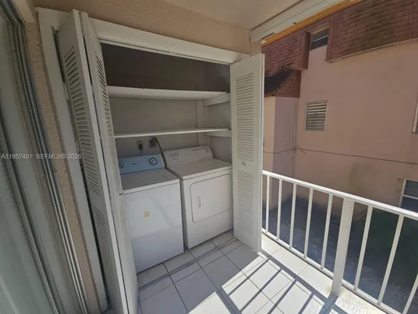 a kitchen with a refrigerator and a sink