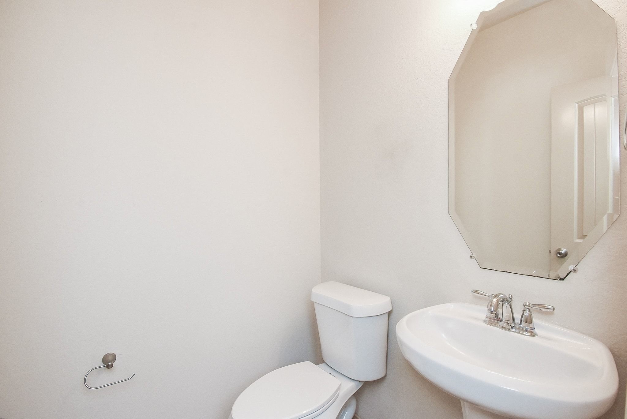 2106 Harmon Crest Court Spring, TX 77373 - Photo 17 of 37 a bathroom with a toilet a sink and mirror