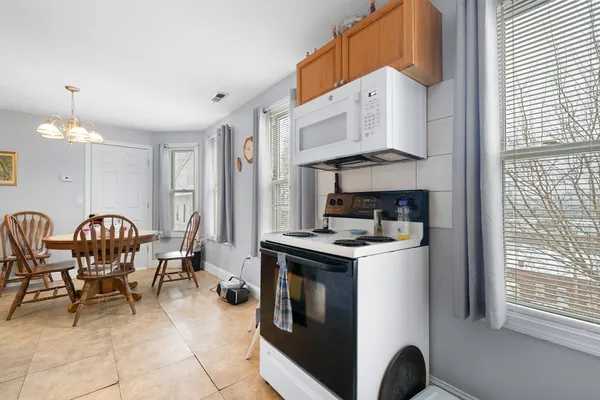 a kitchen with stainless steel appliances granite countertop a stove and a refrigerator