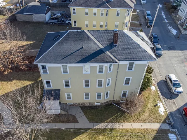 a view of house with yard