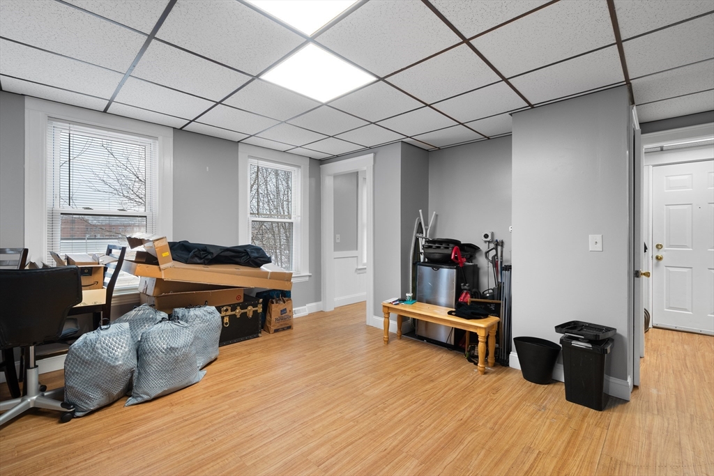 15 King Philip Road Worcester, MA 01606 - Photo 6 of 42 a living room with furniture gym equipment and a large window