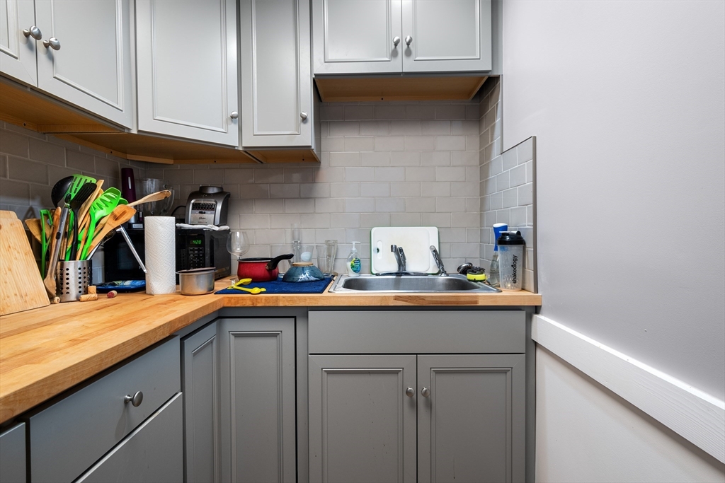 15 King Philip Road Worcester, MA 01606 - Photo 8 of 42 a kitchen with stainless steel appliances granite countertop a sink a stove and cabinets