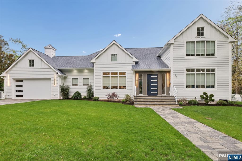 31 Engleside Street Cresskill, NJ 07626 - Photo 1 of 49 a front view of a house with a garden and yard