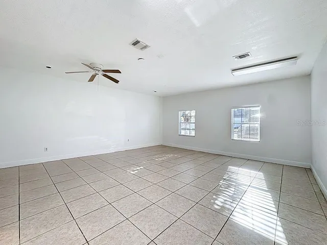 a view of an empty room with a window