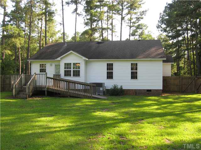 5519 Devils Racetrack Road Four Oaks, NC 27524 - Photo 9 of 12 Nice deck on rear. Sellers are in process of having it stained. Wheelchair ramp can be removed but is very sturdy. NEW HVAC system (gas pack)