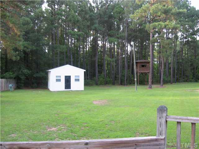 5519 Devils Racetrack Road Four Oaks, NC 27524 - Photo 10 of 12 Note the big "man cave" or storage barn and elevated "tree house". No houses behind this one either.