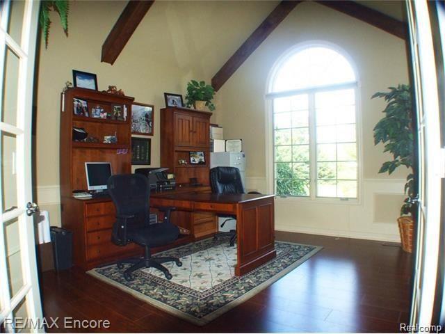8629 Sashabaw Road Clarkston, MI 48348 - Photo 16 of 34 Home office space with cathedral ceiling, arch window and exposed beams. Could be used as third bedroom on main floor.